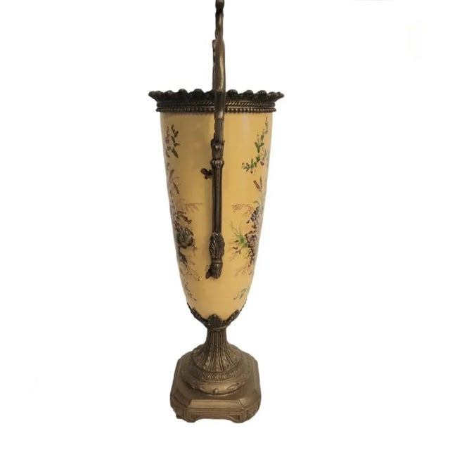 A beautiful extra tall and extremely heavy ceramic and metal French decorative urn. This is such a wonderful piece with a...