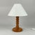 Swedish design pine table lamp, 1970s This table lamp features a turned wooden base with intricate grooves and curves,...