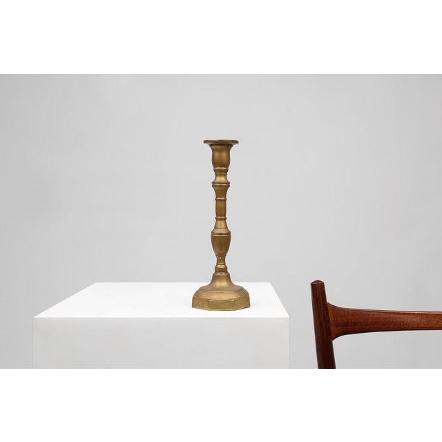 This refined candlestick was crafted in France around 1890, a period when bronze craftsmanship reached a high level of...