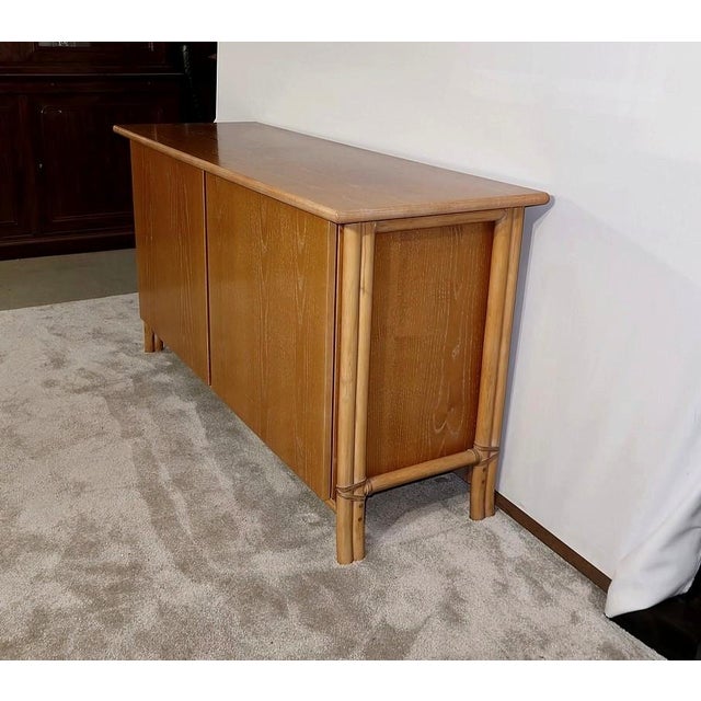Large sideboard in limed ash with orange highlights from Maison Gasparucci Italo. This Italian furniture brand created in...