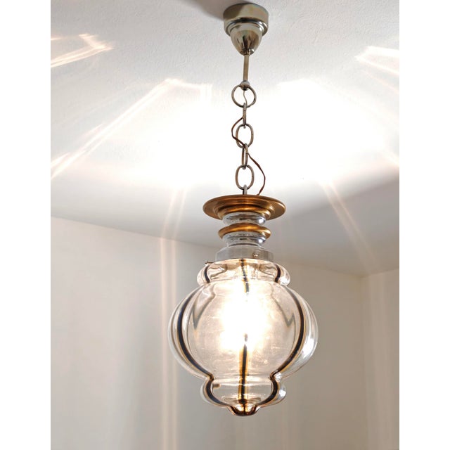 Vintage Murano glass pendant chandelier, attributed to designer Toni Zuccheri and made in Italy around the 1960s or 1970s....