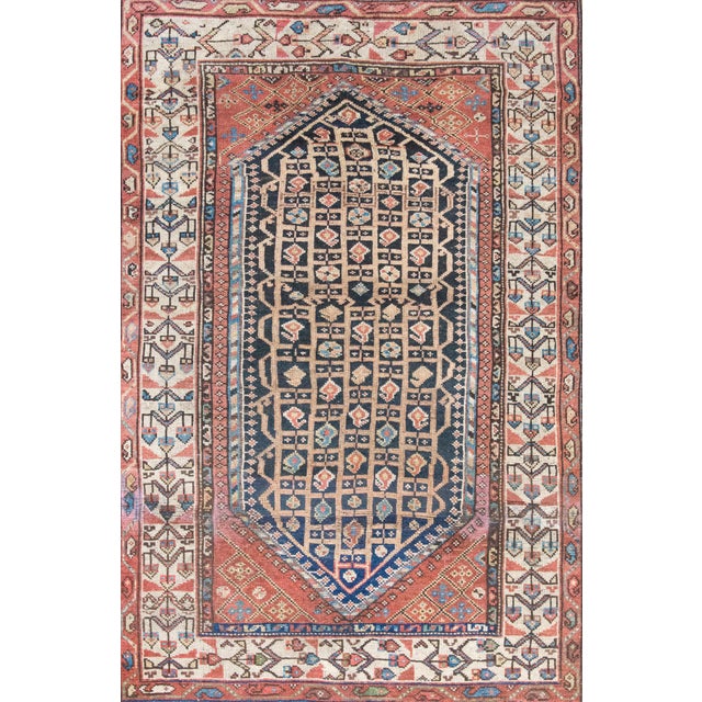 Woven around 1900, this early 20th-century Persian Khamseh rug showcases the geometric elegance and folk charm...