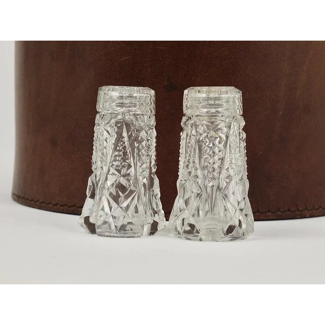 A set of beautiful Art Nouveau salt and pepper shakers, made of facetted glass. Made in France in the 1920s, in excellent...