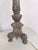 This cast metal candlestick table lamp features a Neoclassical-inspired design. Featuring intricate relief details of...