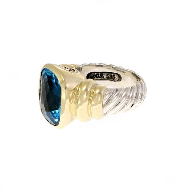 This authentic ring is by David Yurman from the Noblesse Collection. It is crafted from sterling silver and 14k yellow...