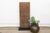 Carved from two adjoining planks of hardwood and joined along their length with cord lashings — a construction method...