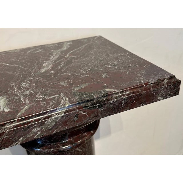 Red Levanto marble pedestal. Pedestal is in 4 sections. Base is 13" Diameter.