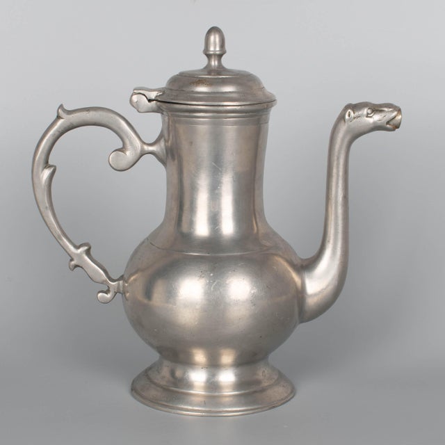 19th Century German pewter lidded coffee pot by Gustav Metten featuring an elongated body, hinged lid with acorn finial, a...