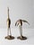 This pair of mid-century brass cranes showcases intricate detailing, capturing the graceful elegance of long-legged water...