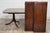 This is an absolutely beautiful vintage Sheraton or Regency style banded mahogany double pedestal extension dining table...