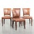 We’re offering this comfortable set of 4 grained cognac-colored cowhide dining chairs finished with large decorative...