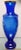 This Vintage Fenton Gilded Cobalt Glass Mary Gregory Style Roses Motif Baluster Vase measures 16 3/4" tall.