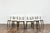 A set of six dining chairs, model 124, designed by Helena and Jerzy Kurmanowicz and manufactured by Radomszczańskie...