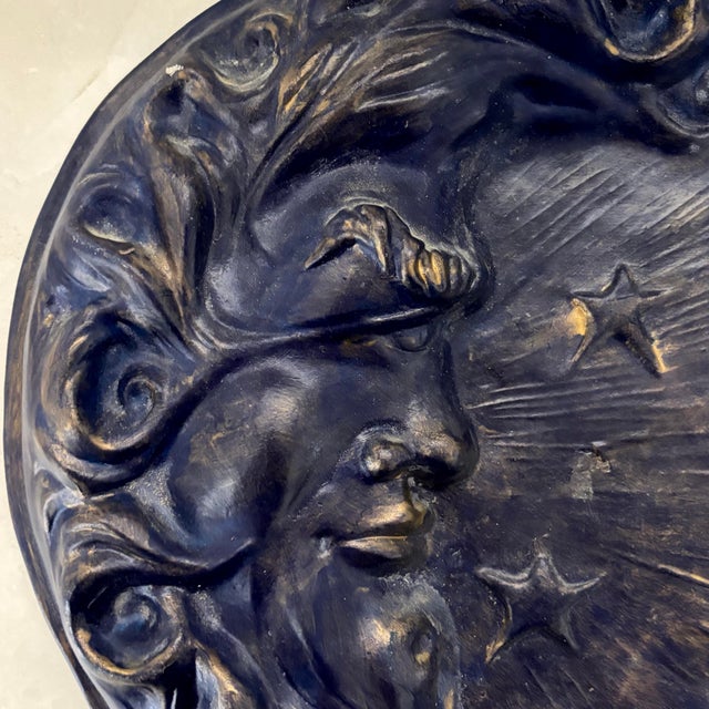 Studio pottery made wall plaque, with incised anthropomorphized moon with stars. Marked Thomas Ceramics, Marshall, Texas....