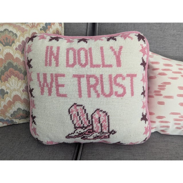 The "Trust in Dolly" Needlepoint Pillow made by Furbish featuring the phrase, "In Dolly We Trust" Perfect for anyone who...