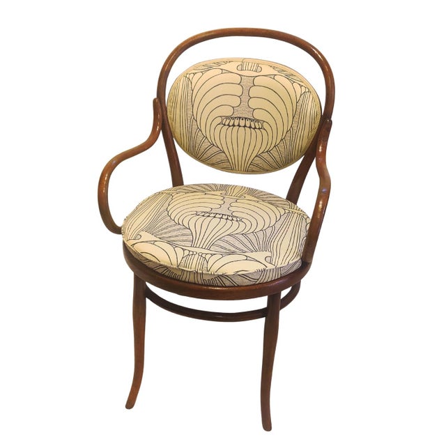 Art Nouveau bentwood armchair, circa 1900, attributed to Thonet. The chair displays the elegant curved backrest and...