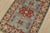 A tribal Caucasian Kazak rug hand-knotted with fine wool on a cotton foundation. This rug features a central medallion...