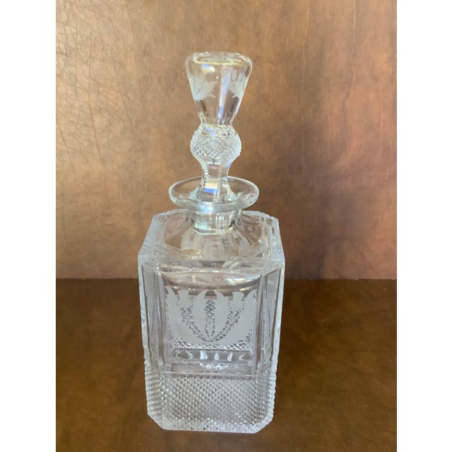 Cut crystal decanter and 4 glasses made in Scotland; traditional Scottish Thistle pattern. The glasses are designed to...