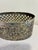 A vintage silverplate oval basket by International Silver Company featuring an elegant pierced lattice design and classic...