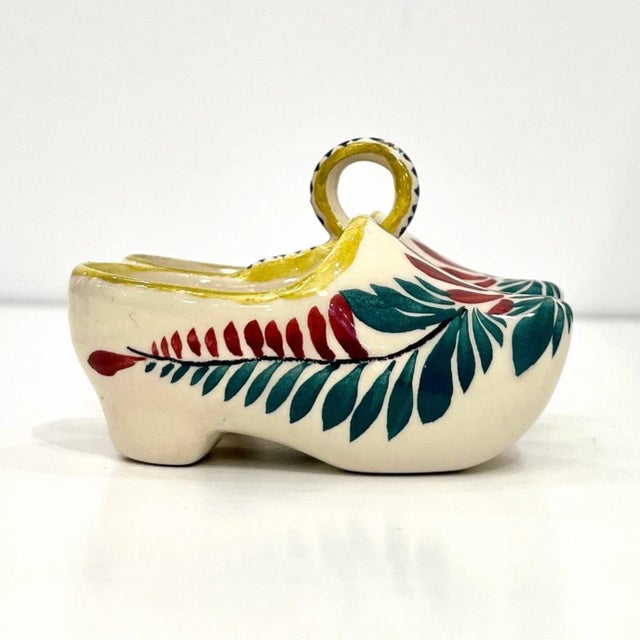 A charming handcrafted decorative salt and pepper holder in the shape of traditional Breton sabot clogs, mid-20th century...