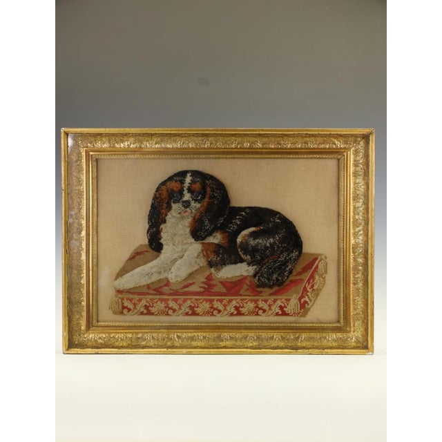 Large Framed 19th Century Folk Art Woolwork of a King Charles Spaniel on a Cushion This is a delightfully charming and...