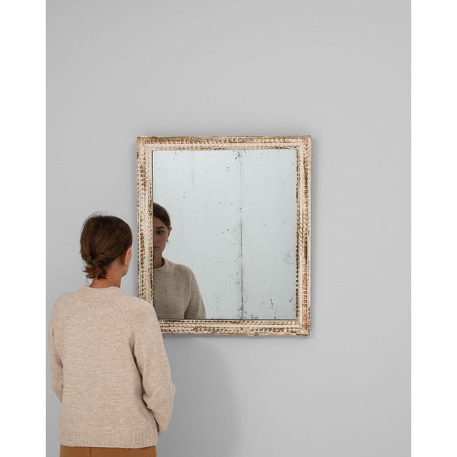 This piece presents as a mirror, distinguished by distressed white/cream ornate frame. Originating in France during 19th...