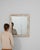 This piece presents as a mirror, distinguished by distressed white/cream ornate frame. Originating in France during 19th...