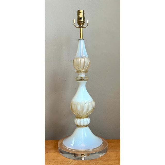 This exquisite vintage Murano table lamp exemplifies the artistry and innovation of mid-century Italian glassmaking....