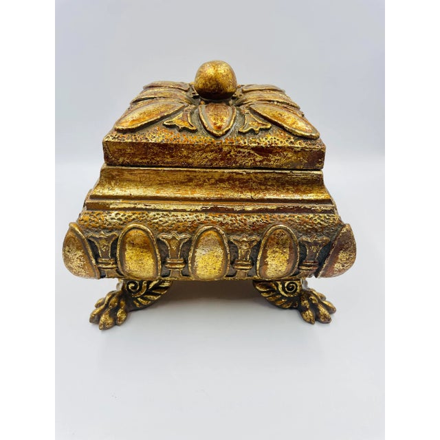 This stunning and substantial old Treasure Box features a wonderful clawfoot-design with an ornate pattern and gold gilt...