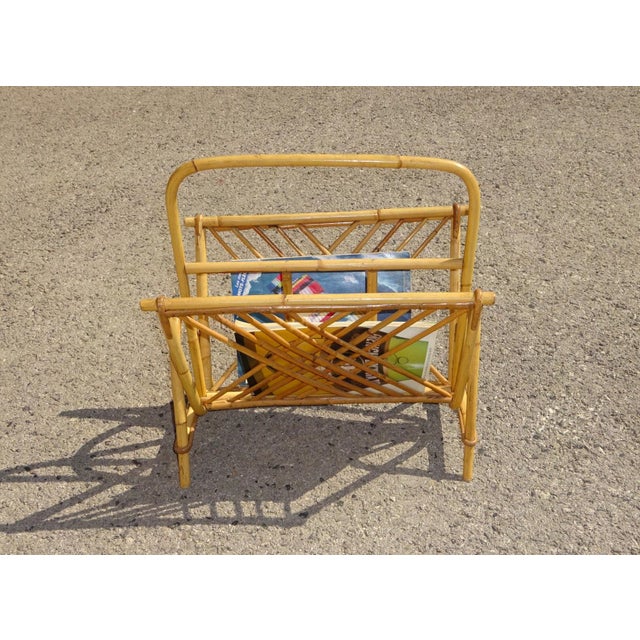 Rattan magazine rack with two storage compartments and a handle. The side is decorated with a diamond pattern. Lightweight...