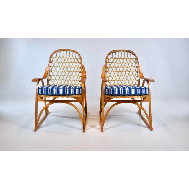 A pair of vintage Snowshoe Arm Chairs by Snocraft of Norway, Maine, with new custom cotton linen blue & white striped seat...
