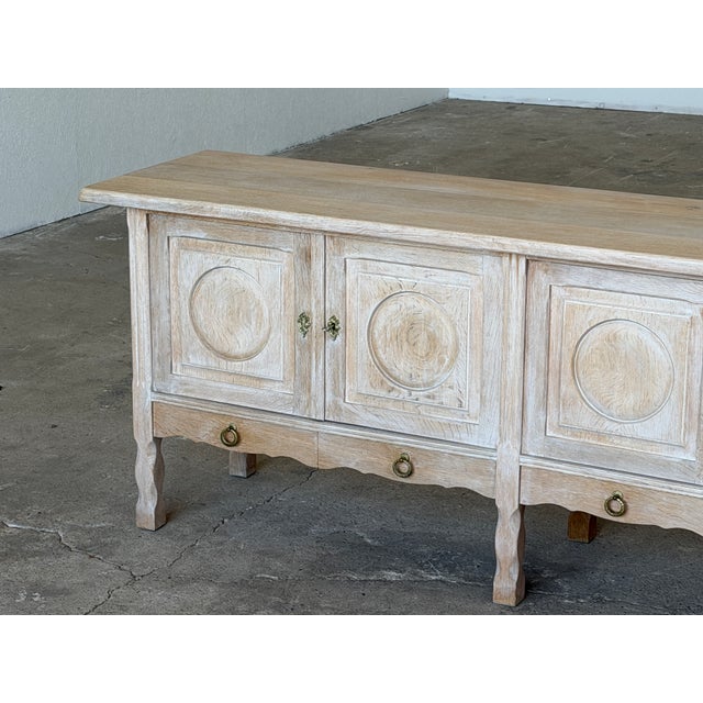 A large oak sideboard in the danish brutalist tradition, attributed to henning kjærnulf and produced in denmark during the...