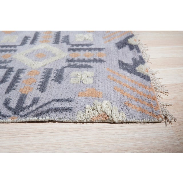 Laine Enchanting Gray Hand Knotted Wool Rug, Country of Origin: India. This exceptional piece showcases the skill and...