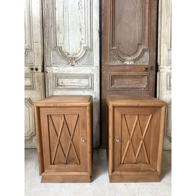 Pair of bedside tables in oak and oak veneer, circa 1930-50. Single-door front with cross-shaped elements. Adjustable...