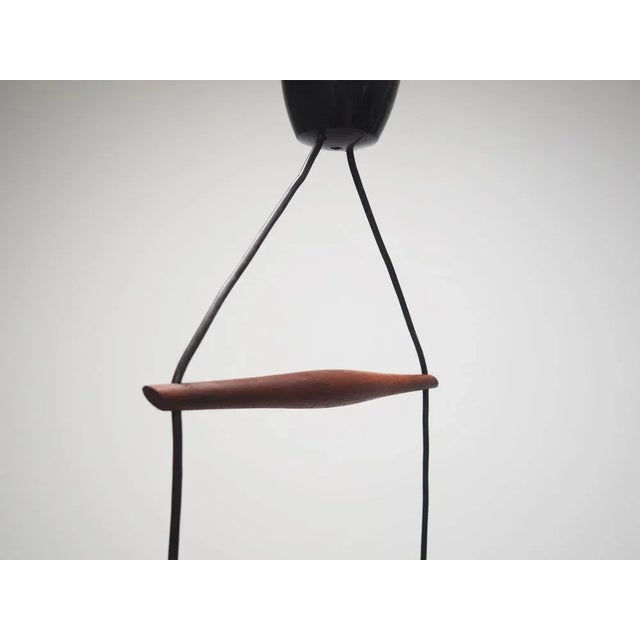 The lamp was made in the 1970s, Danish production. Made of teak wood and glass. The cable is adjustable in length. The...