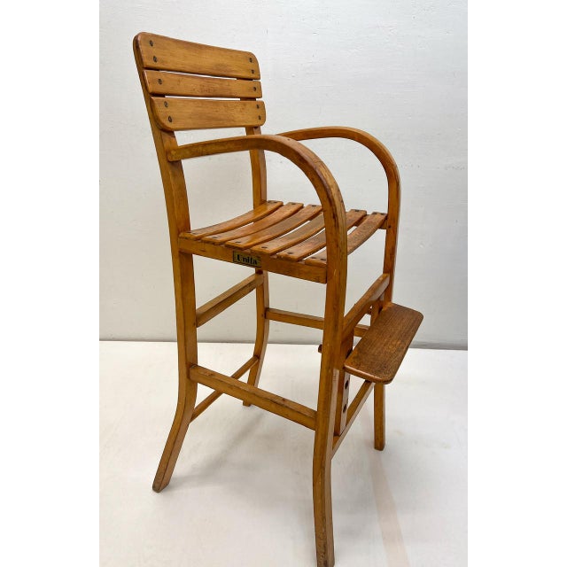 1960s Beechwood Children's Chair by French brand Unifa. with armrests and an adjustable footrest. Imported at the time by...