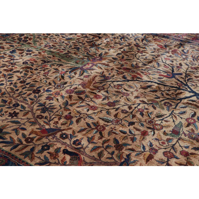 Hand-knotted in wool and originating from India circa 1920-1930, this 15×15 antique square rug is inspired by Persian rugs...