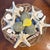 A striking celebration of organic design, this coastal centerpiece shifts the focus from simple arrangement to the...