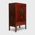 Crafted in the mid-19th century, this striking red lacquer cabinet was likely part of a traditional wedding dowry,...