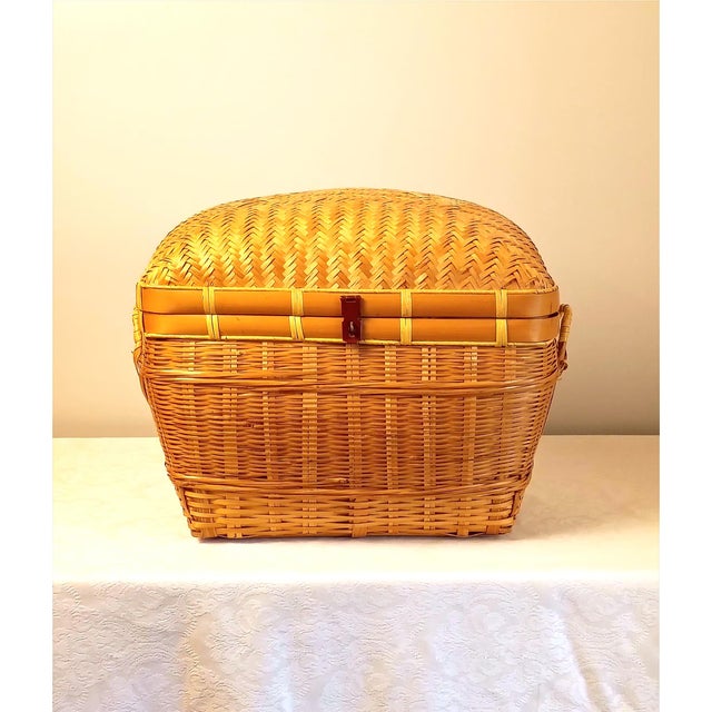 This structural hamper trunk represents the fine mid-20th-century tradition of Asian-inspired basketry, showcasing...