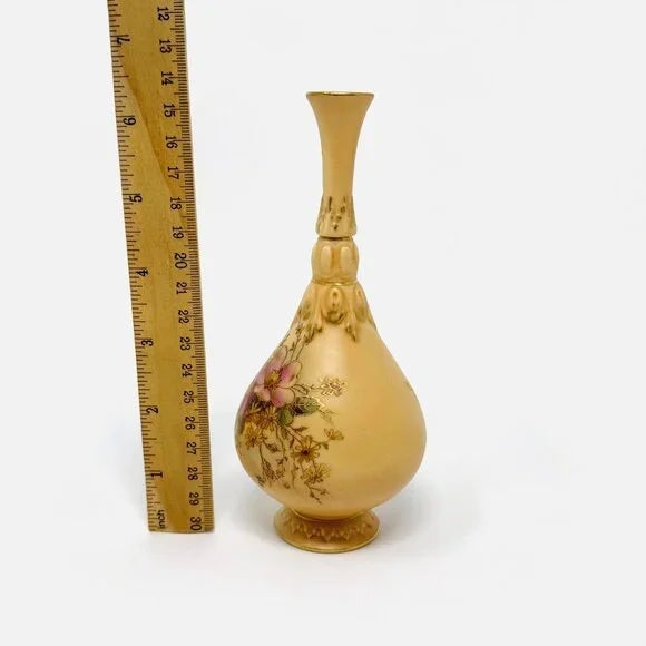 A delightful petite antique Royal Worcester vase showcasing beautiful hand-painted floral details. Standing 6 1/4 inches...