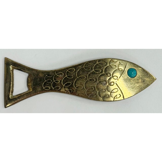 Vintage Isreali brass fish shaped bottle opener featuring lovely engraved pattern with an Eilat blue eye. Patina.