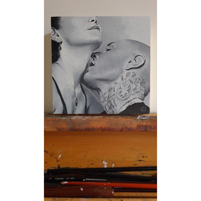 This oil on panel artwork captures an intimate moment between two figures, their closeness conveyed through tender...