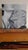 This oil on panel artwork captures an intimate moment between two figures, their closeness conveyed through tender...
