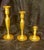This set of three vintage brass candlestick holders features classic mid-century geometric designs and tiered, beaded...
