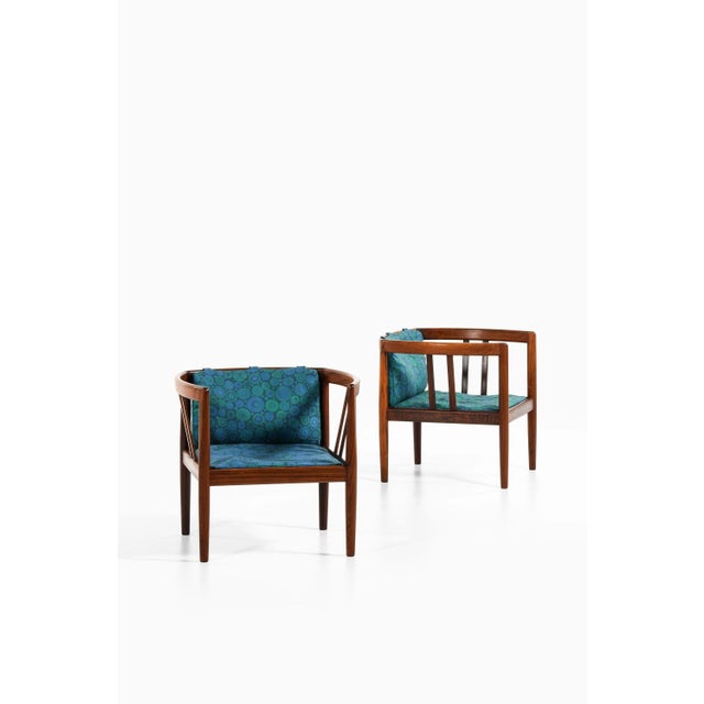 Easy chairs in rosewood and original fabric by illum wikkelsø, 1964 additional information: material: rosewood and...