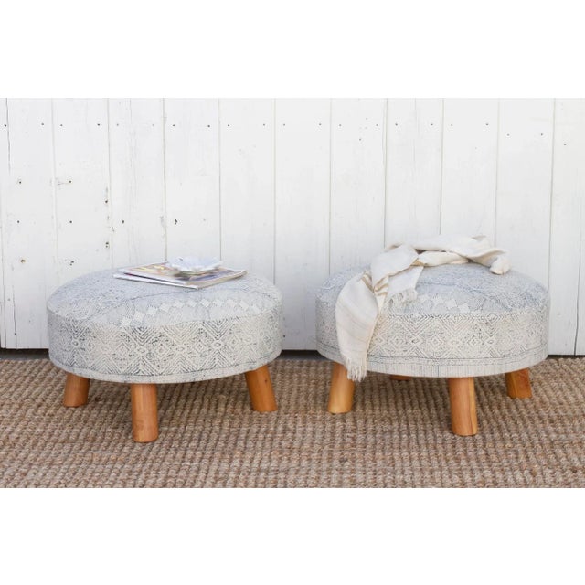 This pair of versatile round dhurrie ottomans, feature a stunning cotton cover adorned with a captivating blue tribal...