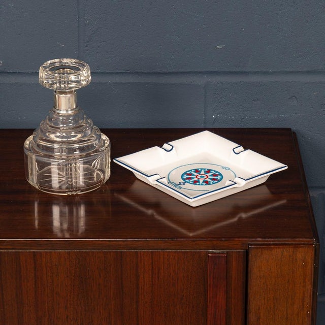 A stylish ceramic ashtray by gucci, crafted in italy in the late 20th century. Of square form with four cigarette rests,...