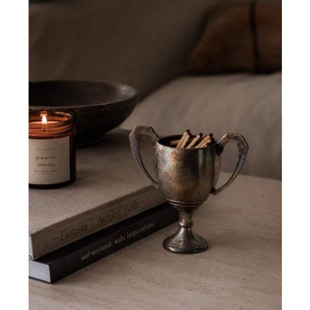 A perfectly proportioned little trophy cup with serious vintage character. The twin angular handles — flat-topped and...