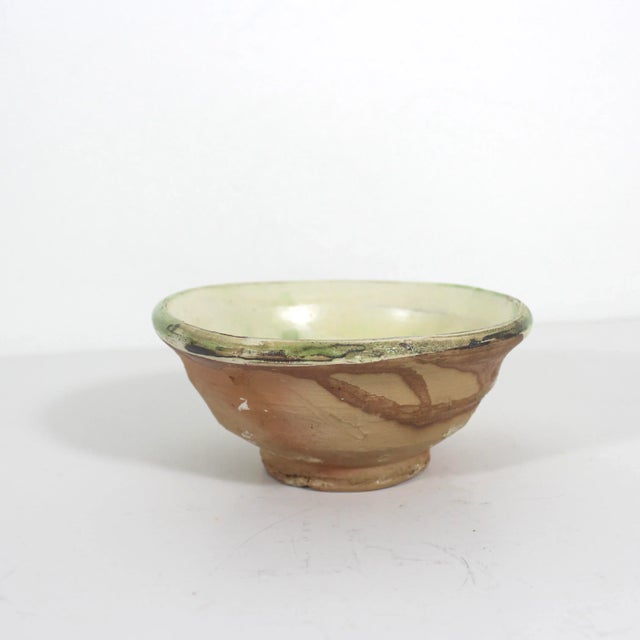 This is a beautiful, rustic, primitive clay bowl with a bird in the style of antique Byzantine ceramics with a half glazed...